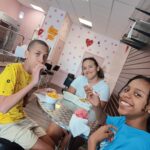 Middle grade students enjoying ice cream treats at nearby shop; Camp Canopy 2025
